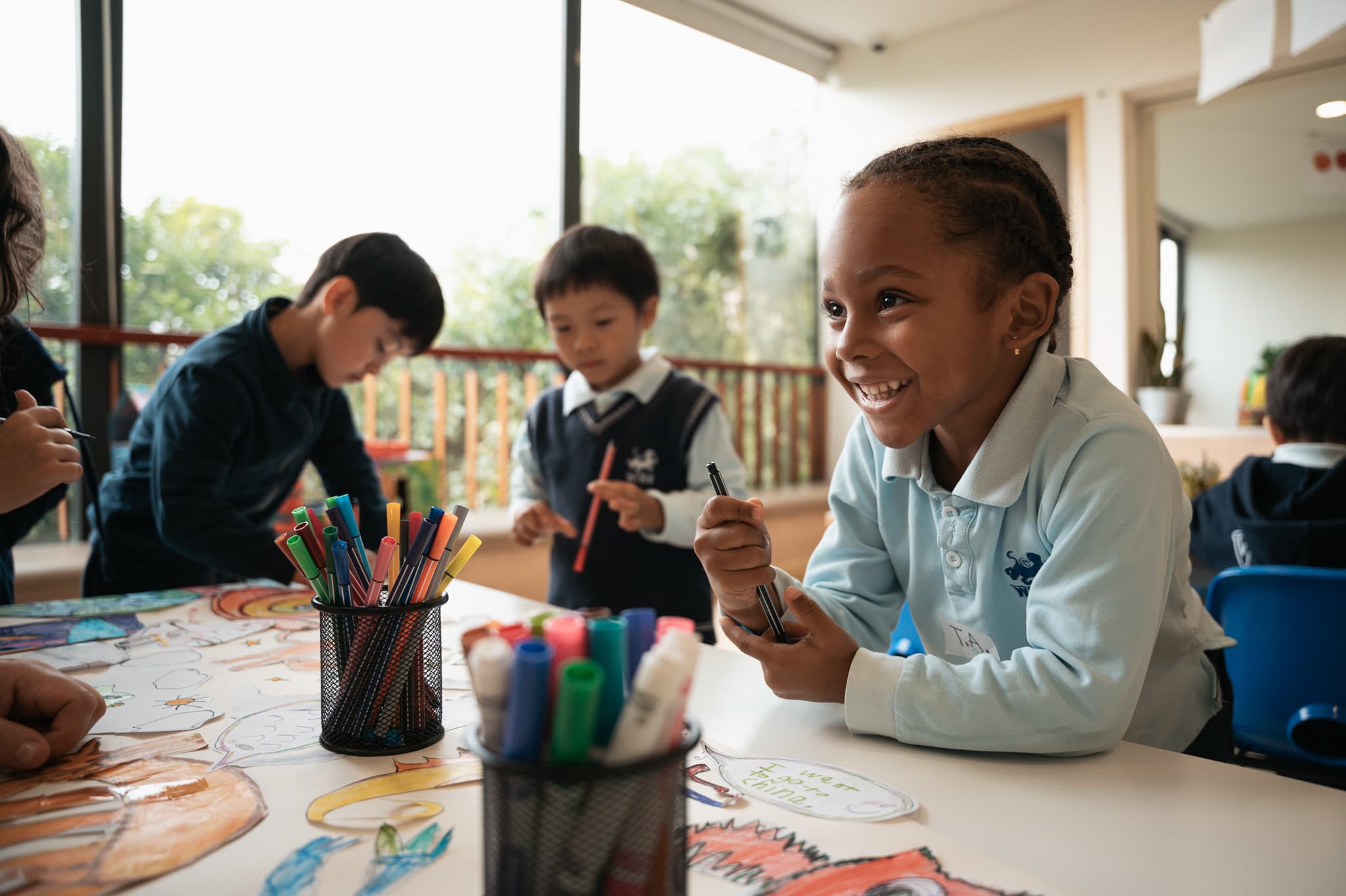Students doing art activities together in classroom