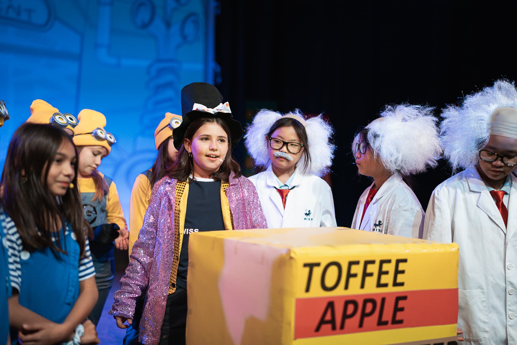 Students performing in school musical production